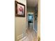 Hallway with wood floors, artwork and view to the bedroom at 3545 Renaissance Cir, Atlanta, GA 30349