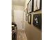 Hallway with decorative artwork and a white door to a bedroom or bathroom at 3545 Renaissance Cir, Atlanta, GA 30349
