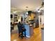Open kitchen with stainless steel appliances, hardwood floors, granite countertops, and breakfast bar seating at 3545 Renaissance Cir, Atlanta, GA 30349