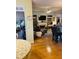 Open-concept living room with hardwood floors, leading to a cozy living space at 3545 Renaissance Cir, Atlanta, GA 30349