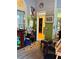 A cozy sunroom with decor, wooden floors, and a view into the home's interior at 3545 Renaissance Cir, Atlanta, GA 30349