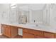 Bathroom vanity with double sinks, large mirrors, and a bathtub at 1795 Waterside Nw Dr, Kennesaw, GA 30152
