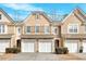 Inviting townhome with attached garages and manicured landscaping for great curb appeal at 1795 Waterside Nw Dr, Kennesaw, GA 30152