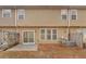 Townhome exterior featuring a small patio with a wood privacy fence at 1795 Waterside Nw Dr, Kennesaw, GA 30152