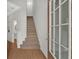 Bright entryway showcasing hardwood floors, a staircase, and an open view, welcoming visitors at 1795 Waterside Nw Dr, Kennesaw, GA 30152