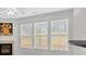 Bright living room with fireplace and large windows, perfect for relaxation at 1795 Waterside Nw Dr, Kennesaw, GA 30152