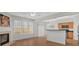 Open-concept living space with a fireplace, kitchen, and ample natural light, ideal for modern living at 1795 Waterside Nw Dr, Kennesaw, GA 30152