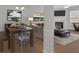 Well-lit open living space with dining area, fireplace, and hardwood floors for a comfortable atmosphere at 1795 Waterside Nw Dr, Kennesaw, GA 30152