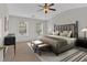 Spacious main bedroom with high ceilings, carpet floors, sitting area and neutral color palette at 1795 Waterside Nw Dr, Kennesaw, GA 30152