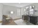 Well-lit office with a desk, chair, decor, and large windows at 1795 Waterside Nw Dr, Kennesaw, GA 30152