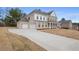 Lovely brick home with an attached two-car garage and concrete driveway at 185 Haverling Pass, Hampton, GA 30228