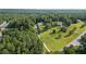 Aerial view of a large home on a large lot with mature trees and a long drive at 450 Ledbetter Rd, Villa Rica, GA 30180