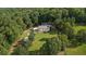 Aerial view of a charming two story home with pool, expansive yard, and mature trees at 450 Ledbetter Rd, Villa Rica, GA 30180