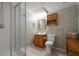 Cozy bathroom featuring a tiled shower, wood cabinets, and neutral wall color at 450 Ledbetter Rd, Villa Rica, GA 30180