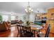 Open dining room with view of kitchen and living room, featuring a chandelier at 450 Ledbetter Rd, Villa Rica, GA 30180