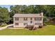 Two-story home with cream siding, red shutters, well-kept lawn, and an American flag at 450 Ledbetter Rd, Villa Rica, GA 30180