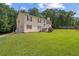Two-story home with cream siding, red shutters, well-kept lawn, and attached garage at 450 Ledbetter Rd, Villa Rica, GA 30180