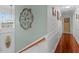 Hallway with wood floors, white wainscoting, and view of front door at 450 Ledbetter Rd, Villa Rica, GA 30180