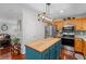 Kitchen featuring wood cabinets, stainless appliances and an island with wood countertop at 450 Ledbetter Rd, Villa Rica, GA 30180