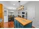 Kitchen featuring wood cabinets, stainless appliances and view of dining room and living room at 450 Ledbetter Rd, Villa Rica, GA 30180