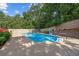 Refreshing pool area with lounge chairs and well-maintained landscaping, perfect for outdoor relaxation at 450 Ledbetter Rd, Villa Rica, GA 30180