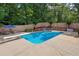 Relaxing backyard pool and hot tub with manicured landscaping, perfect for entertaining or enjoying the outdoors at 450 Ledbetter Rd, Villa Rica, GA 30180