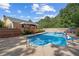 Inviting pool with surrounding deck, complemented by a charming gazebo and lush backyard greenery at 450 Ledbetter Rd, Villa Rica, GA 30180