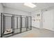 Utility room with dog kennels, built-in storage, and durable epoxy flooring at 450 Ledbetter Rd, Villa Rica, GA 30180