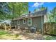 Backyard featuring a deck, privacy fence, tree coverage and some lawn area at 1788 Campbellton Sw Rd, Atlanta, GA 30311