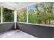 Enclosed porch with views of the lush backyard at 1788 Campbellton Sw Rd, Atlanta, GA 30311
