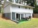 Backyard featuring an attached patio area, well-maintained lawn, and private fence at 2099 Redbud Sw Ct, Marietta, GA 30008