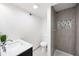 Bathroom with modern vanity, updated toilet, and sleek walk-in shower featuring a mosaic tile niche at 2099 Redbud Sw Ct, Marietta, GA 30008