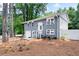 Charming split-level home features a grey brick facade and a well-manicured front yard at 2099 Redbud Sw Ct, Marietta, GA 30008
