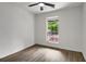 Bright bedroom featuring modern ceiling fan, wood-look floors, and natural light at 8689 Cedar Creek Rdg, Riverdale, GA 30274