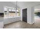 Charming breakfast nook with bay window, new lighting fixture, and modern flooring at 8689 Cedar Creek Rdg, Riverdale, GA 30274