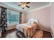 Cozy bedroom with natural light, wood floors, and floral print curtains at 955 Juniper Ne St # 4127, Atlanta, GA 30309