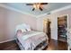 Light-filled bedroom showcasing hardwood floors, walk-in closet and ensuite bathroom at 955 Juniper Ne St # 4127, Atlanta, GA 30309