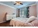 Bright bedroom featuring a dresser and a window with a view of the outside at 955 Juniper Ne St # 4127, Atlanta, GA 30309