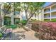 Serene courtyard with benches, lush landscaping, and mature trees offering shade at 955 Juniper Ne St # 4127, Atlanta, GA 30309