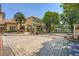The community entrance features an automatic gate with mature shade trees at 955 Juniper Ne St # 4127, Atlanta, GA 30309