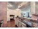 Modern kitchen featuring granite countertops, stainless steel appliances, and an adjacent workspace at 955 Juniper Ne St # 4127, Atlanta, GA 30309