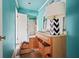 Bright bathroom featuring open vanity storage, sink and mirror, and shower with floral curtains at 10 Shadburn Ferry Rd, Buford, GA 30518