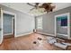 Bedroom featuring hardwood floors, damaged ceiling, a window and a doorway to a bathroom at 10 Shadburn Ferry Rd, Buford, GA 30518