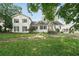 Traditional home showcasing its facade, front yard and mature trees at 10 Shadburn Ferry Rd, Buford, GA 30518