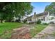 Charming two-story home featuring a stone facade, front yard and mature tree at 10 Shadburn Ferry Rd, Buford, GA 30518