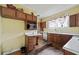 Kitchen with wood cabinets, white countertops, and stainless steel appliances at 10 Shadburn Ferry Rd, Buford, GA 30518