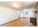 Wide view of the basement, which features light fixtures, an access door, and a brick fireplace at 1737 Fontaine Dr, Jonesboro, GA 30236