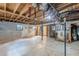 Unfinished basement with exposed wooden beams and pipes for updating the home's system at 1737 Fontaine Dr, Jonesboro, GA 30236