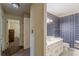 Bright bathroom featuring a white vanity and vintage wallpaper at 1737 Fontaine Dr, Jonesboro, GA 30236