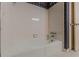 Bathroom with white tiled walls, tiled floors, and a bathtub at 1737 Fontaine Dr, Jonesboro, GA 30236